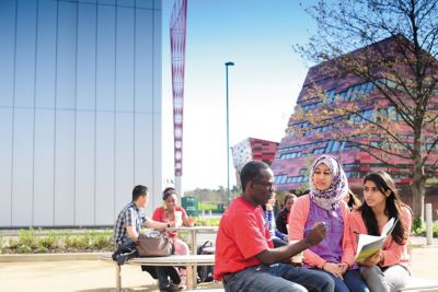 Postgraduate students studying outside on Jubilee campus