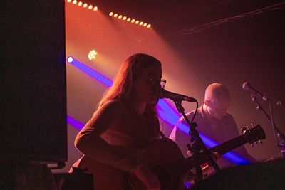 Rebekah performing in her band