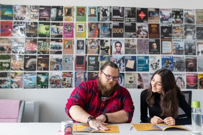 Impact student staff sorting through submissions and discussing the upcoming issue for the Impact magazine. Impact office, Portland Building