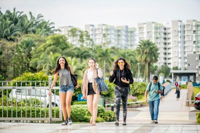 Student walking through Malaysia Campus