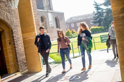 Undergraduates walking past Cripps Hall, University Park