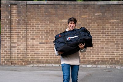 Undergraduate student arriving at Derby hall of residence