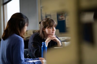 Students studying at a group study space in Business Library
