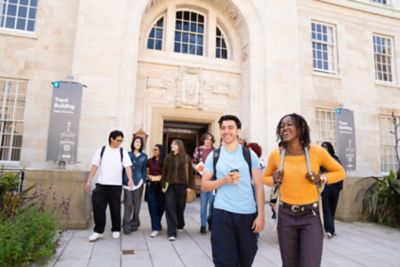 Undergraduate students walking through the Trent Building Quadrangle, University Park