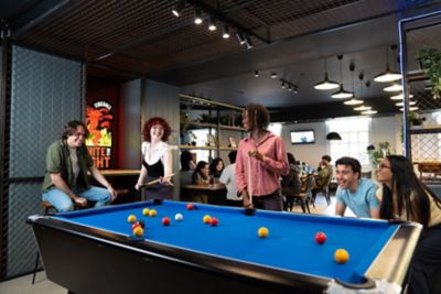 Undergraduate students playing snooker in the Portland Building's Mooch bar on University Park campus