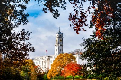 Trent Building framed with autumnal leaves shaped like a heart