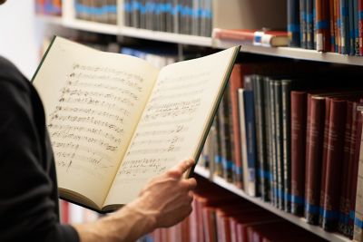 Closeup of sheet music on shelves in the Interior Denis Arnold Music library