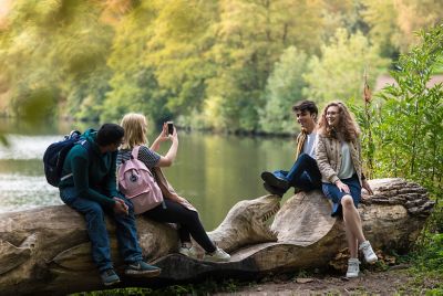 Undergraduate students relaxing around Highfields Lake, University Park