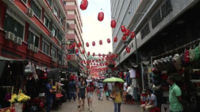 A wide shot walking through a street in Kuala Lumpur