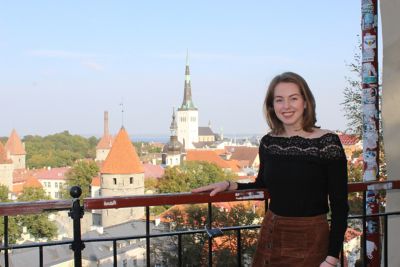 Kathryn Moore smiling on a balcony