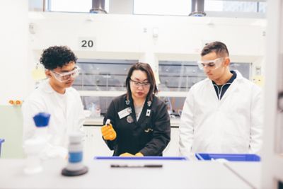 Laboratory staff member Sam Tang helping undergraduates in a chemistry lab session, C10, Chemistry building, University Park. November 5th 2021.Students are John Ventura (left); Sam Tang (middle) and Andrew Laurel (right).
