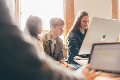 University undergraduate students studying in the Monica Partridge Building Digital Hub. Friday November 5th 2021.Jane Israel (denim jacket); Cole Pearce and Sara Bintey Kabir (yellow top).