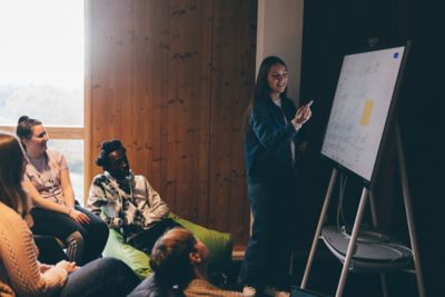 University undergraduate students studying in the Monica Partridge Building Digital Hub. Friday November 5th 2021.Megan Mahoney (blue top); Cole Pearce; Jane Israel (denim jacket) and Sara Bintey Kabir (yellow top); Francis (black and white hoodie); Adam and Lucy Woodward and Zoe Markham-Lee (ponytail)