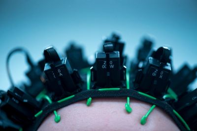 Female PhD student wearing a MEG system that can be worn like a helmet, allowing free and natural movement during scanning October 2019. Photography by Lisa Gilligan-Lee.Copyright belongs to the University of Nottingham.https://www.nottingham.ac.uk/research/beacons-of-excellence/precision-imaging/our-projects/meg/meg.aspx