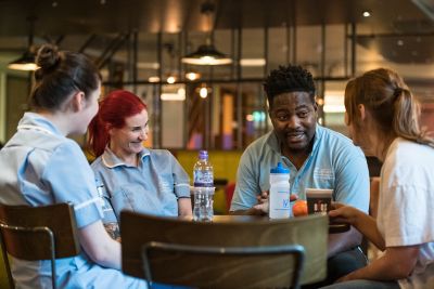 Mental Health Nursing students and staff talking in Hipps Cafe, Medical School, QMC