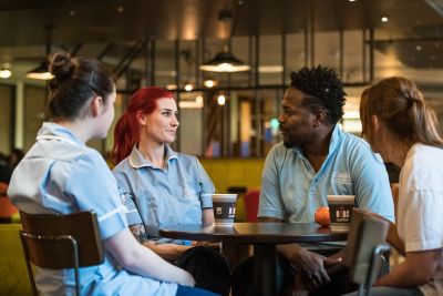 Mental Health Nursing students and staff talking in Hipps Cafe, Medical School, QMC