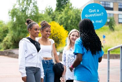 Visitors asking questions during June Open Day 