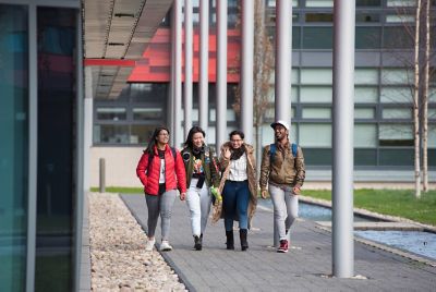 From left to right: Sheerya Rajadhyaksha - Indian; Yongin Wu - Chinese; Mansai Bharati - Indian and Harshad Manavalan - Indian walking outside the Institute for Mental Health, Jubilee Campus.