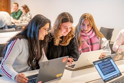 Postgraduate students doing Geography group work in Monica Partridge Building