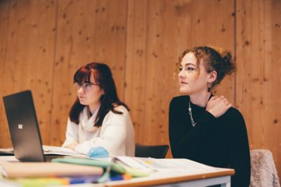 University undergraduates attending a languages seminar in the Monica Partridge building. Friday November 5th 2021.Jade Holden (red hair) and Molly Hawksley (curly hair/black jumper).