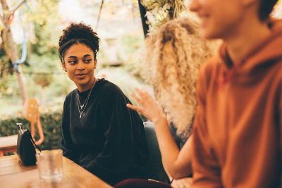 Undergraduate students relaxing in The Secret Garden restaurant in Nottingham City Centre