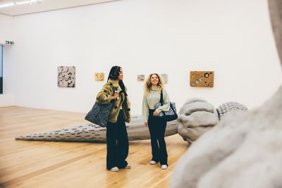 Undergraduate students looking at art work in the Nottingham Contemporary, Nottingham City Centre - November 2021.Lily Pearce (braids) and Fearne Darbyshire (blonde curly hair)