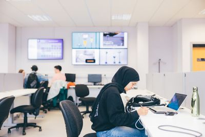 Undergraduate student at a computer desk working in the Product Design Studio