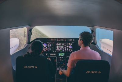 Undergraduate students piloting and co-piloting the flight simulator in engineering labs