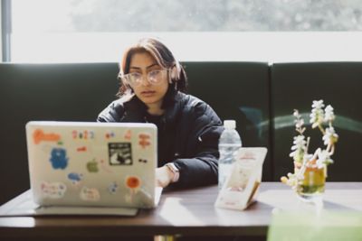 Undergraduate student studying on laptop in Mulberry cafe, Sutton Bonnington campus