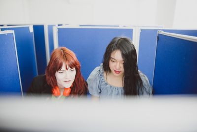 Undergraduate students looking at a computer in CeDEx lab, Clive Granger building