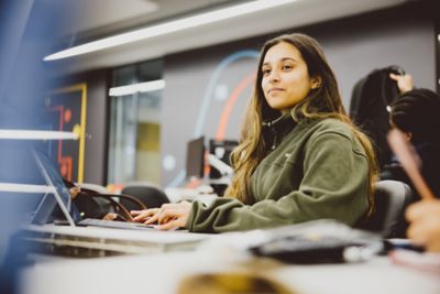 A foundation student attending a lecture in the Advanced Manufacturing Building