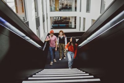 Students walking up the stairs in the Advanced Manufacturing Building