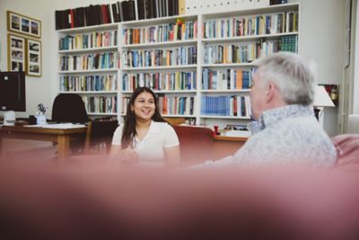 Undergraduate student in a tutorial with an academic