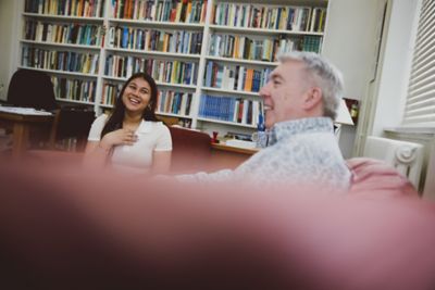 Undergraduate student in a tutorial with an academic