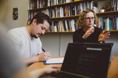 Student and professor English tutorial in Professor Lucy Jones's office