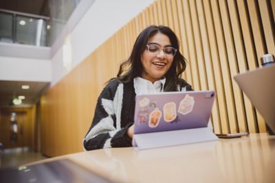 Student studying in the Humanities building atrium