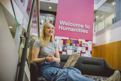 Students relaxing in the Humanities Building communal area