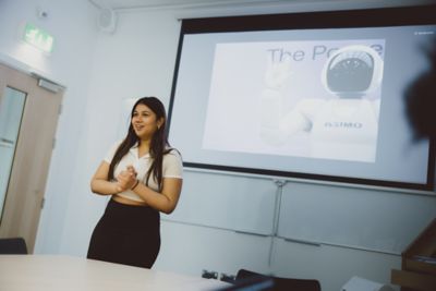 Undergraduate students presenting in a philosophy seminar with Lina Jansson in the Humanities building