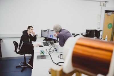 Undergraduate student Anatoliy Antil works with Senior Technician Paul Mundy in our physics labs