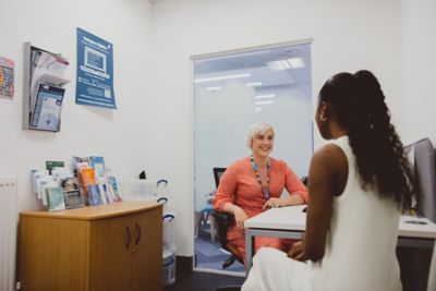 Undergraduate student meeting with a staff member in Student Support Centre, Queen's Medical Centre, University Park