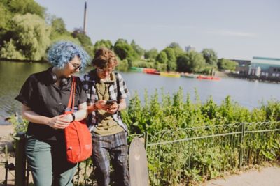 Students relaxing beside Highfields Lake, University Park