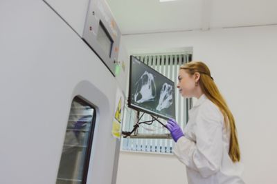 Undergraduate student using the UltraFocus XL X-Ray machine in the A05a Technology Laboratory, Humanities Building,, University Park
