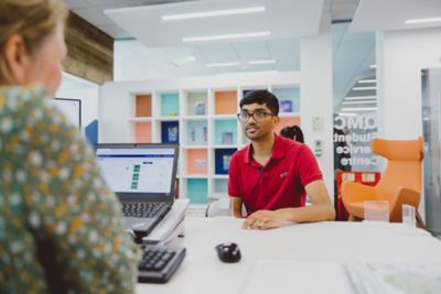 Undergraduate student meeting with a staff member in Student Support Centre, Queen's Medical Centre, University Park
