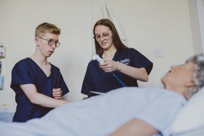 Small group teaching in Consulting Room D1035, Queen's Medical Centre Medical School, University Park