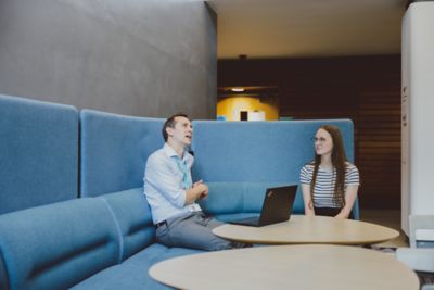 Staff member and Undergraduate student having 1:1 discussion in the reception area of the Medical School, QMC, University Park