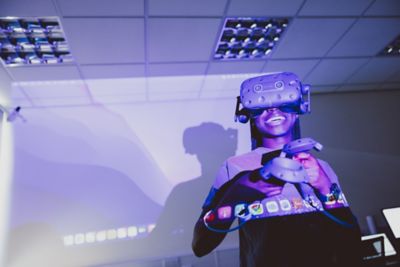 Undergraduate student using a VR headset in the Law Tech lab, Law and Social Sciences Building