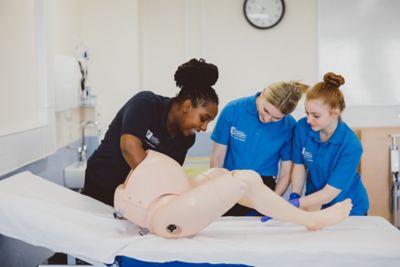 Undergraduate students having simulation of birth hands-on practice in the Health sciences QMC Clinical Skills suite