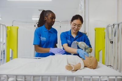 Undergraduate students practicing manual resuscitation on a paediatric simulator