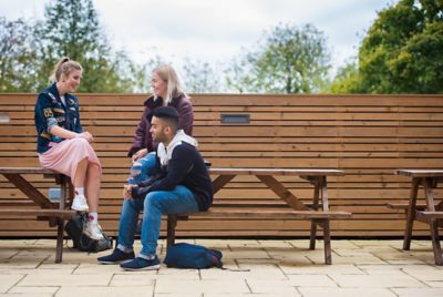 Undergraduate students relaxing on The Terrace, Portland Building, University Park