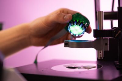 Undergraduate student working with an Aura Phase Contrast Illuminator in EEE Project Laboratory, C13, Pope Building